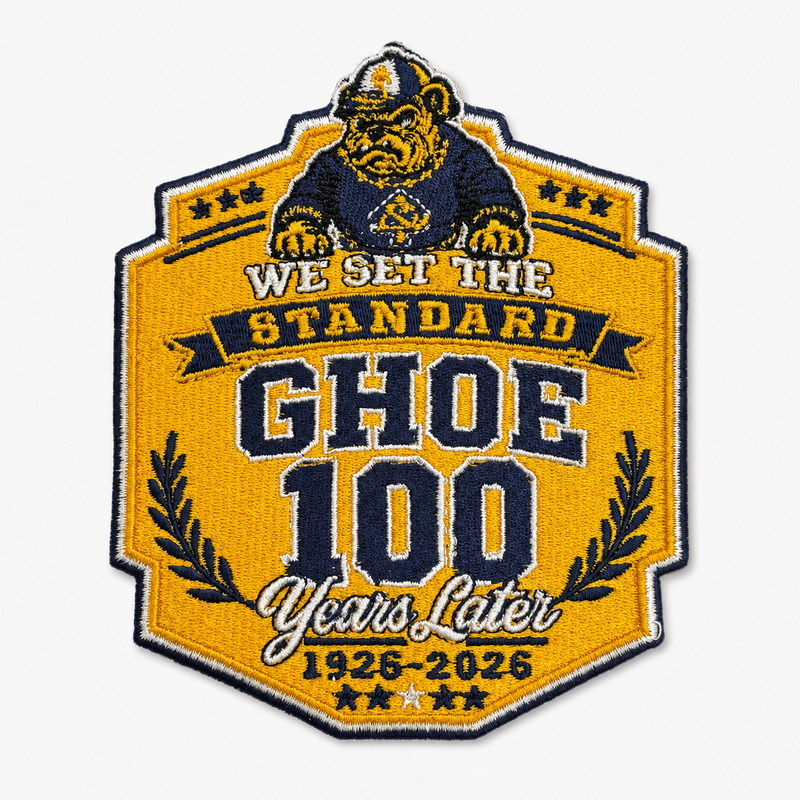 An embroidered patch celebrating the Ghoe brand with a gorilla mascot and the text 'WE SET THE STANDARD GHOE 100 Years Later 1926-2026' on a light gray background.